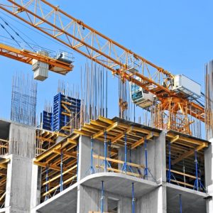 Civil & Structure Crane and building construction site against blue sky